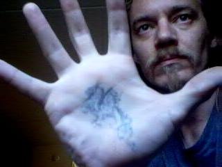 David Ellinger, founder of Martial Arts for Multiple Sclerosis, holding one hand toward the camera